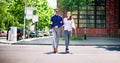 Young Woman Helping Blind Man With White Stick Royalty Free Stock Photo