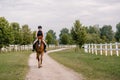 Young woman and her red horse during a calm trail ride