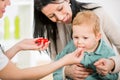 Young woman and her child at the doctor homeopaths Royalty Free Stock Photo