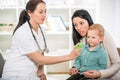 Young woman and her child at the doctor homeopaths Royalty Free Stock Photo