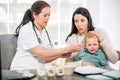 Young woman and her child at the doctor homeopaths Royalty Free Stock Photo