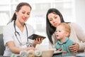 Young woman and her child at the doctor homeopaths Royalty Free Stock Photo