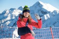 Young woman with her damaged right arm after snowboarding