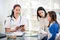 Young woman and her daughter at the doctor homeopaths Royalty Free Stock Photo