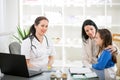 Young woman and her daughter at the doctor homeopaths Royalty Free Stock Photo