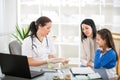 Young woman and her daughter at the doctor homeopaths Royalty Free Stock Photo