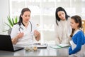 Young woman and her daughter at the doctor homeopaths Royalty Free Stock Photo