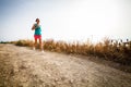 Young woman on her evening jog along the seacoast Royalty Free Stock Photo