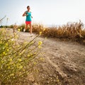 Young woman on her evening jog along the seacoast Royalty Free Stock Photo