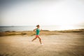 Young woman on her evening jog along the seacoast Royalty Free Stock Photo