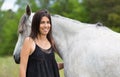 Young woman with her horse