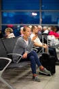 Young woman with her luggage at an international airport