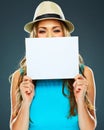 Young woman hides his face behind a banner . Royalty Free Stock Photo