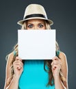 Young woman hides his face behind a banner Royalty Free Stock Photo