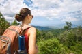 Young woman hiker with backpack enjoying mountains view. Royalty Free Stock Photo