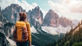 Young woman hiker with backpack enjoying view of Dolomites mountains, Italy. Royalty Free Stock Photo