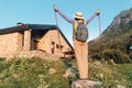 woman hiker camping near the beautiful shelter stone hut building in Pyrenees mountains. Hiking and adventure concept Royalty Free Stock Photo