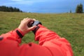 Hiker checking the altimeter on sports watch at mountain peak Royalty Free Stock Photo