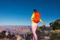 Young woman hiker on the edge of Grand canyon Royalty Free Stock Photo