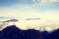 Young woman hiker open arms on mountain peak Royalty Free Stock Photo