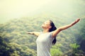 Young woman hiker open arms at moutain Royalty Free Stock Photo