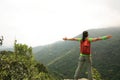 Young woman hiker open arms outdoor Royalty Free Stock Photo