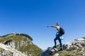 Hiker on mountain pointing