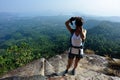 Young woman hiker taking photo with dslr camera Royalty Free Stock Photo