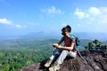 Young woman hiker using smartphone