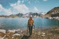 Young Woman hiking at blue lake in mountains Travel Lifestyle adventure concept summer vacations outdoor exploring Royalty Free Stock Photo