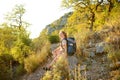 Young woman hiking in countryside. Concepts of adventure, extreme survival, orienteering. Backpacking hike Royalty Free Stock Photo