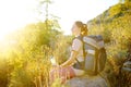 Young woman hiking in countryside. Concepts of adventure, extreme survival, orienteering. Single travel. Backpacking Royalty Free Stock Photo