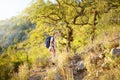 Young woman hiking in countryside. Concepts of adventure, extreme survival, orienteering. Backpacking hike Royalty Free Stock Photo