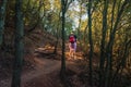 young woman hiking on a forest track. enjoying her holiday. woman walking in nature.