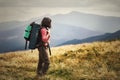 Young woman hiking on mountains with backpack Travel Lifestyle a Royalty Free Stock Photo