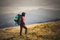 Young woman hiking on mountains with backpack Travel Lifestyle a Royalty Free Stock Photo