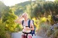 Young woman hiking on mountains in Europe. Concepts of adventure, extreme survival, orienteering. Backpacking hike Royalty Free Stock Photo