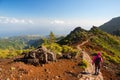 Young woman hiking on path to Pico Ruivo, highest peak of Madeira island, Portugal Royalty Free Stock Photo