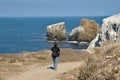 Young woman on hiking trail in East Anacapa Island in Channel Islands National Park, California.