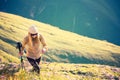 Young Woman hiking with trekking poles Travel Lifestyle concept Royalty Free Stock Photo