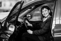 A young woman in his new car. Black and white photography. Royalty Free Stock Photo