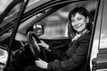 A young woman in his new car. Black and white photography. Royalty Free Stock Photo