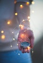 Young woman hold compass in hand at the sea shore. Selective focus. Shallow depth of field