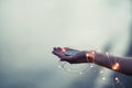 Young woman hold compass in hand at the sea shore. Selective focus. Shallow depth of field