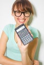 Young woman hold digital calculator. Female smiling model isolated white background Royalty Free Stock Photo