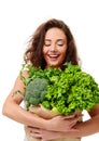 Young woman hold grocery paper shopping bag full of fresh green vegetables Royalty Free Stock Photo