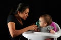 Young woman hold inhaler on kid face Royalty Free Stock Photo