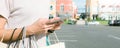 Young woman hold a shopping bags in her hand and chatting on her phone after shopping. Royalty Free Stock Photo