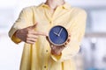 Young woman holding alarm clock Royalty Free Stock Photo