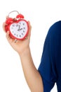 Young woman holding alarmclock. Royalty Free Stock Photo